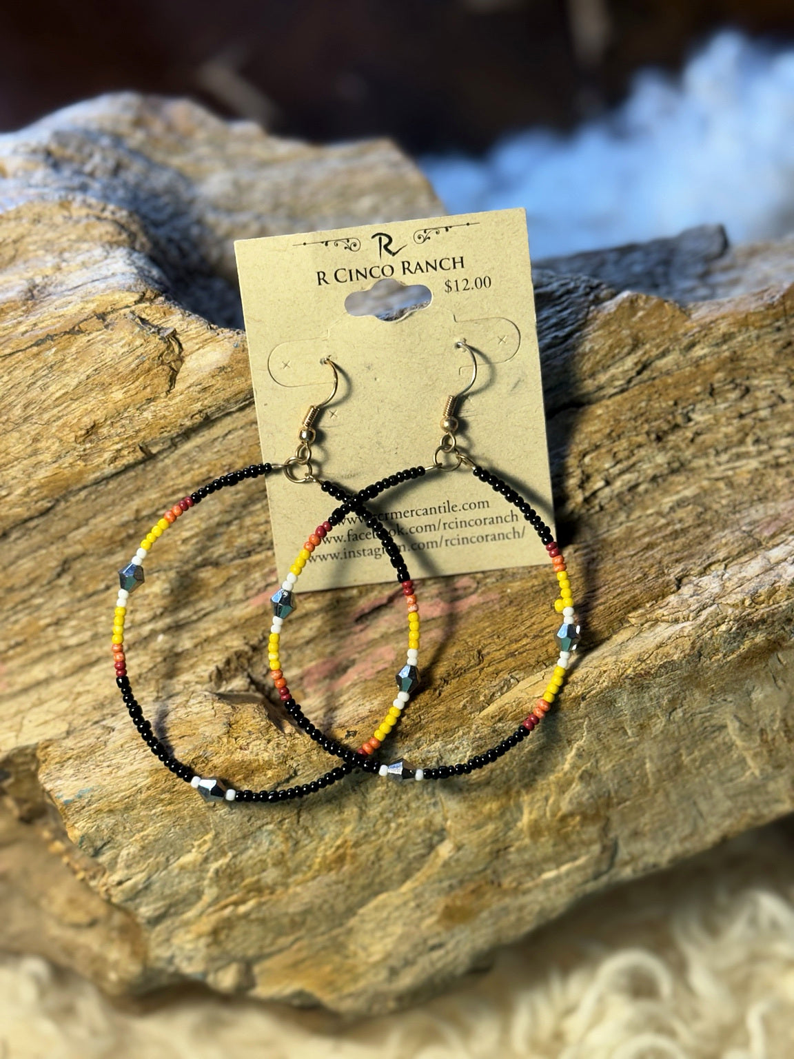 Black seed bead hoop earrings with colorful bead sections and turquoise geometric accents