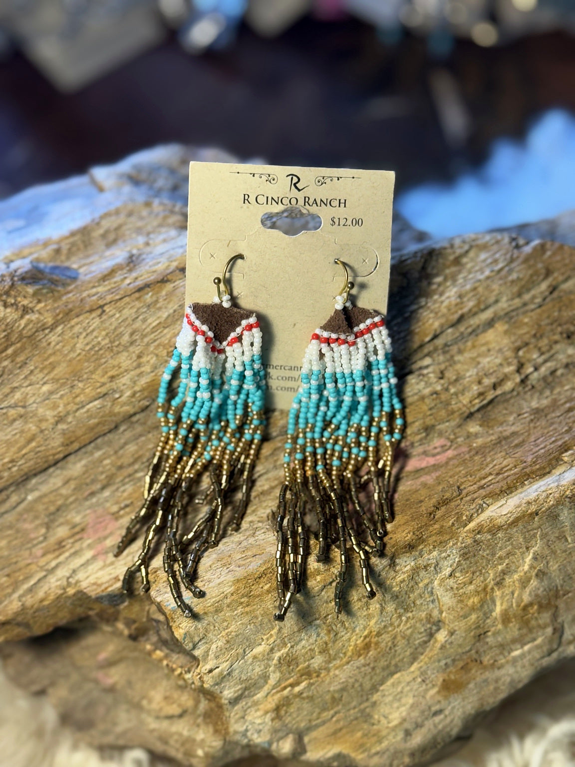 Brown and turquoise seed bead fringe earrings with white, red, and gold-tone bead details