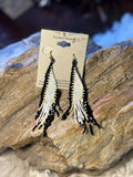 Black and white geometric seed bead fringe earrings with long alternating bead strands