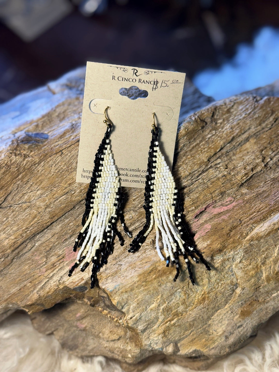 Black and white geometric seed bead fringe earrings with long alternating bead strands