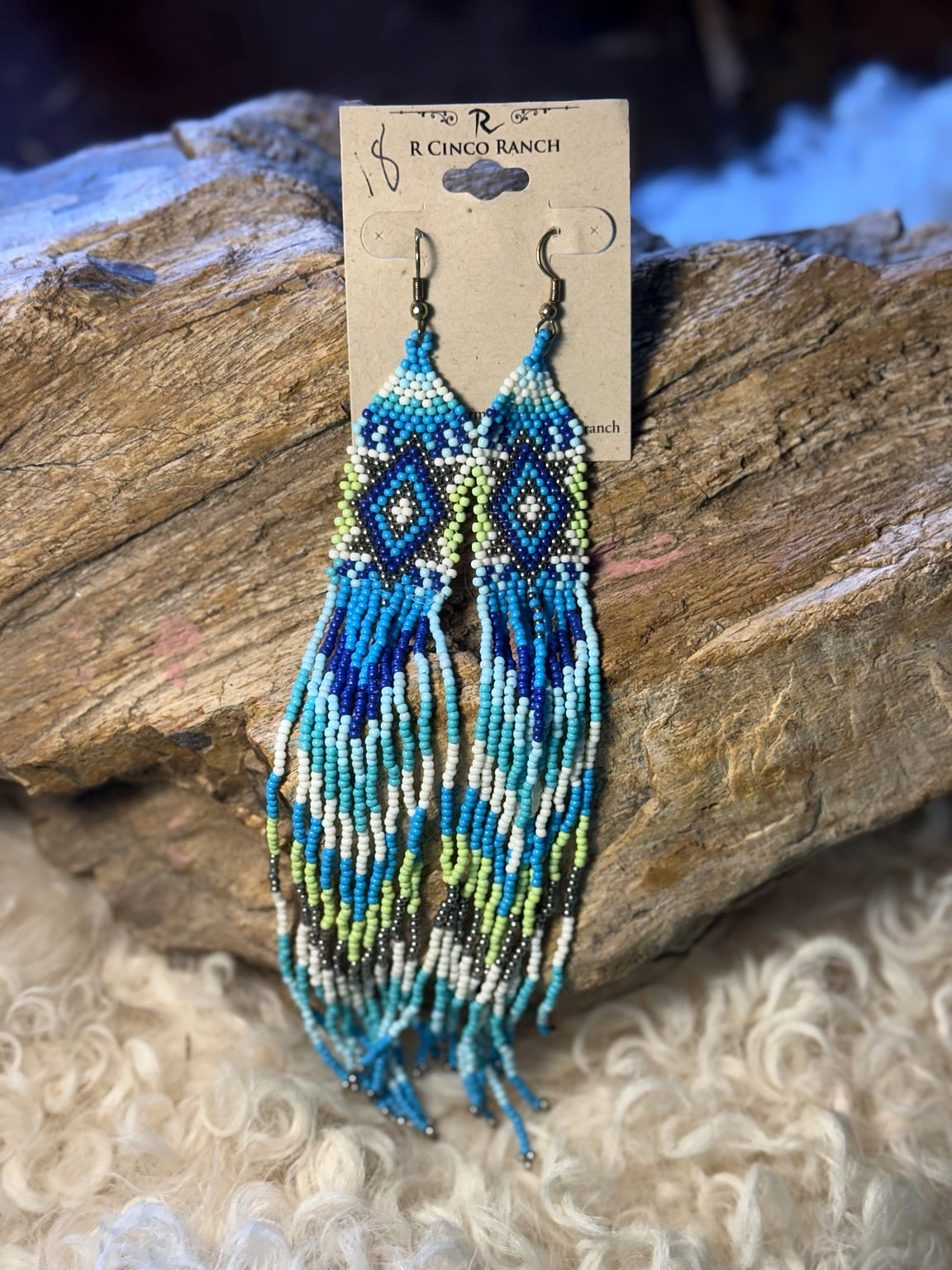 Extra-long turquoise and blue seed bead fringe earrings with green and cream diamond patterns and blue tassels