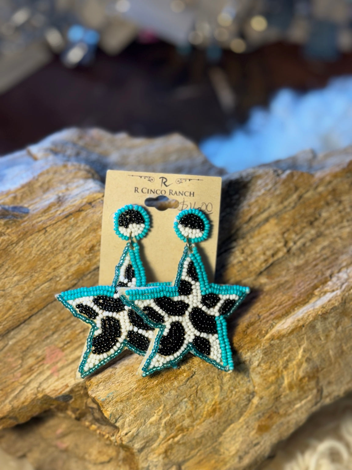 Turquoise, black, and white seed bead statement earrings with star-shaped drops