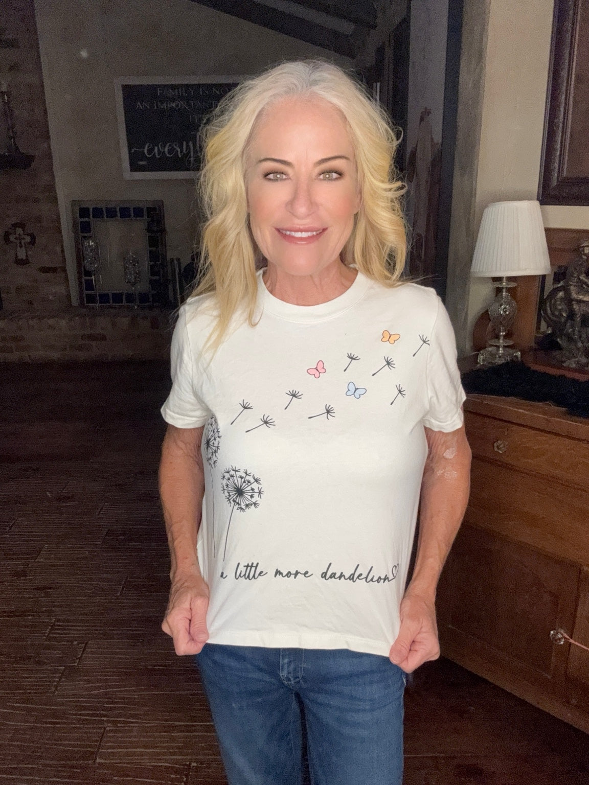 A Little More Dandelion Graphic Tee modeled in cream