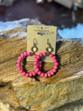 Hot pink beaded hoop earrings with iridescent accents