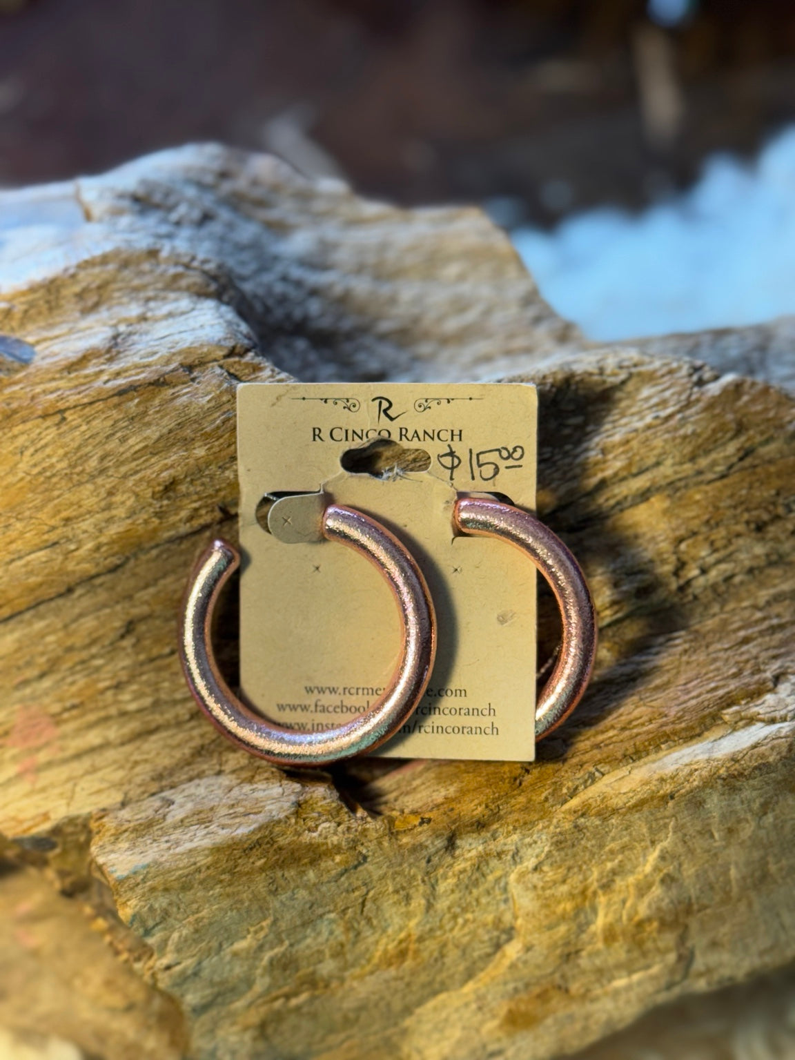 Dark iridescent beaded hoop earrings with multicolor shimmer