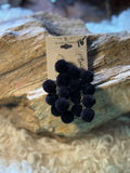Black pom-pom cascade earrings