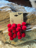 Red pom-pom cascade earrings