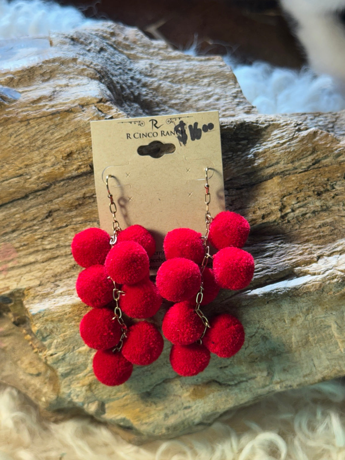 Red pom-pom cascade earrings
