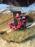 Pink leopard pom-pom hoop earrings