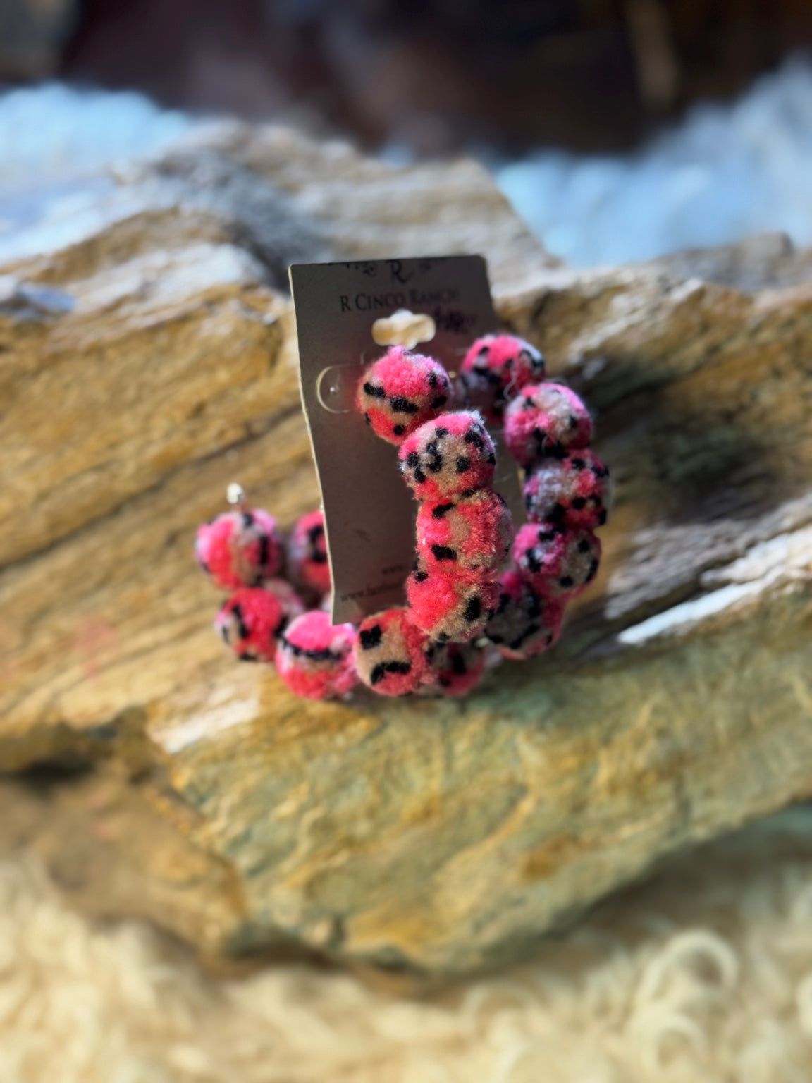 Pink leopard pom-pom hoop earrings