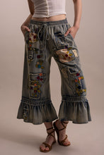 Angled front view of Blue Velvet embroidered patchwork ruffle pants