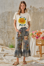 Model wearing Grow in Grace rose tee with Blue Velvet embroidered patchwork ruffle pants