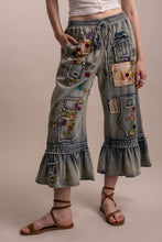 Side angle view of Blue Velvet embroidered patchwork ruffle pants