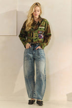 Full-length front view of Camo in Bloom sequin jacket