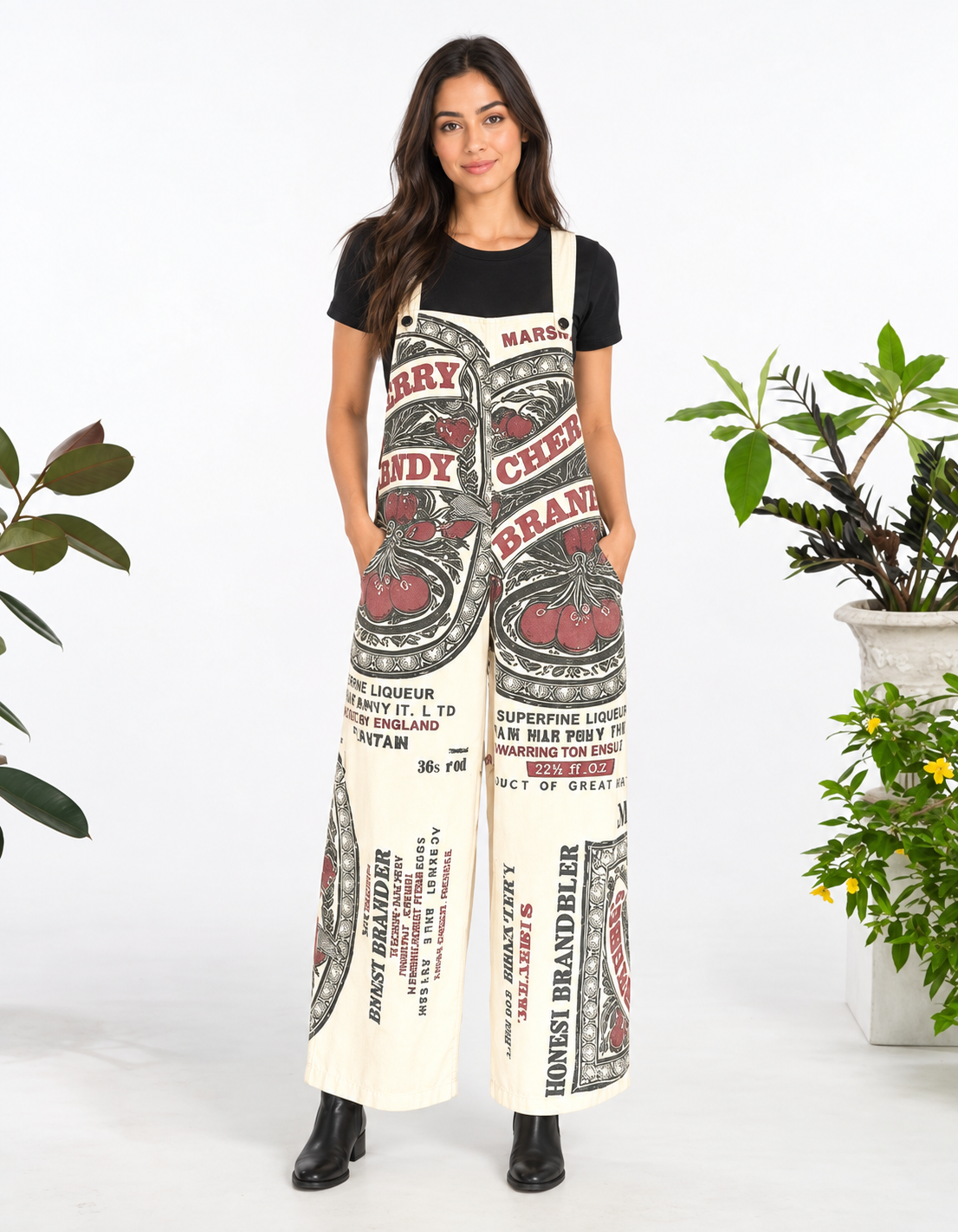 Model wearing the Cherry vintage feed sack wide-leg jumpsuit with a black tee and black ankle boots