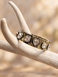 Clear crystal heart bracelet in an antiqued gold-tone finish