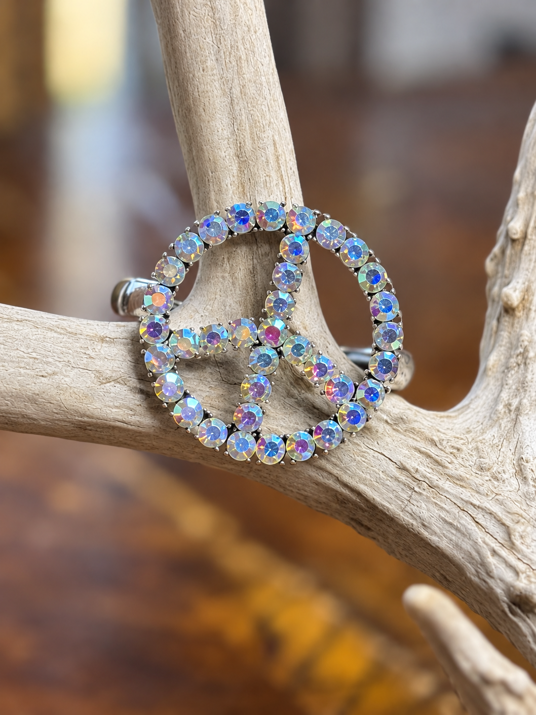 Clear rhinestone peace sign silver-tone bracelet, front view