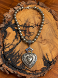 Crowned Heart Beaded Necklace on rustic wood