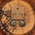 Two-Tone Hammered Heart Medallion Hoop Earrings on a plain kraft card