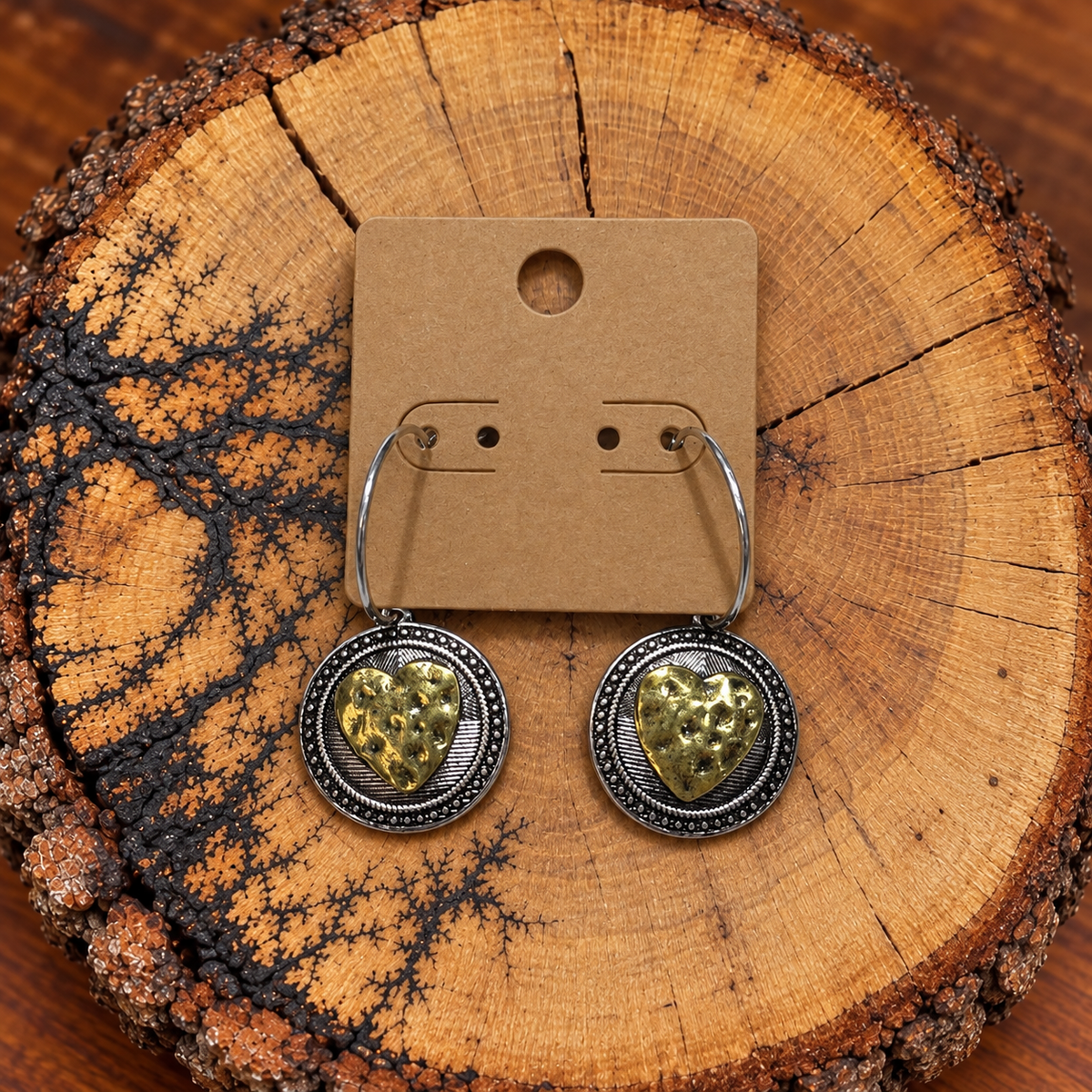 Two-Tone Hammered Heart Medallion Hoop Earrings on a plain kraft card