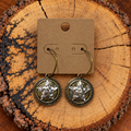 Two-Tone Hammered Star Medallion Hoop Earrings on a plain kraft card