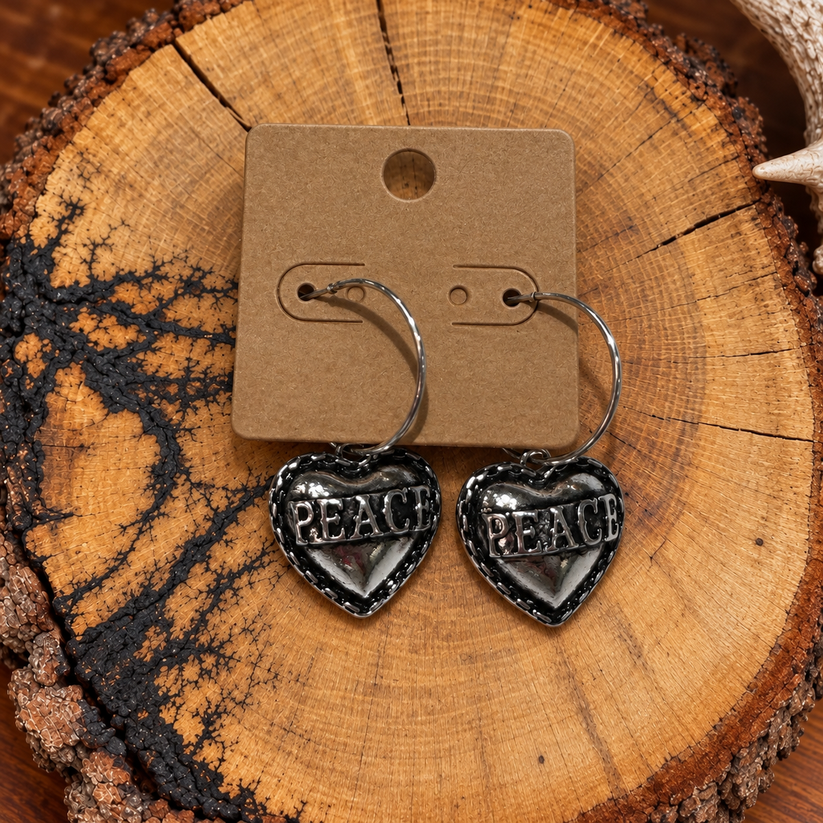 Peace Heart Hoop Earrings on a plain kraft card