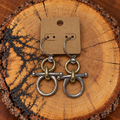 Snaffle Bit Hoop Earrings – Silver-Tone with Gold Accents on a plain kraft card