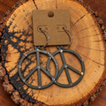Crystal-Accent Peace Sign Hoop Earrings on a plain kraft card