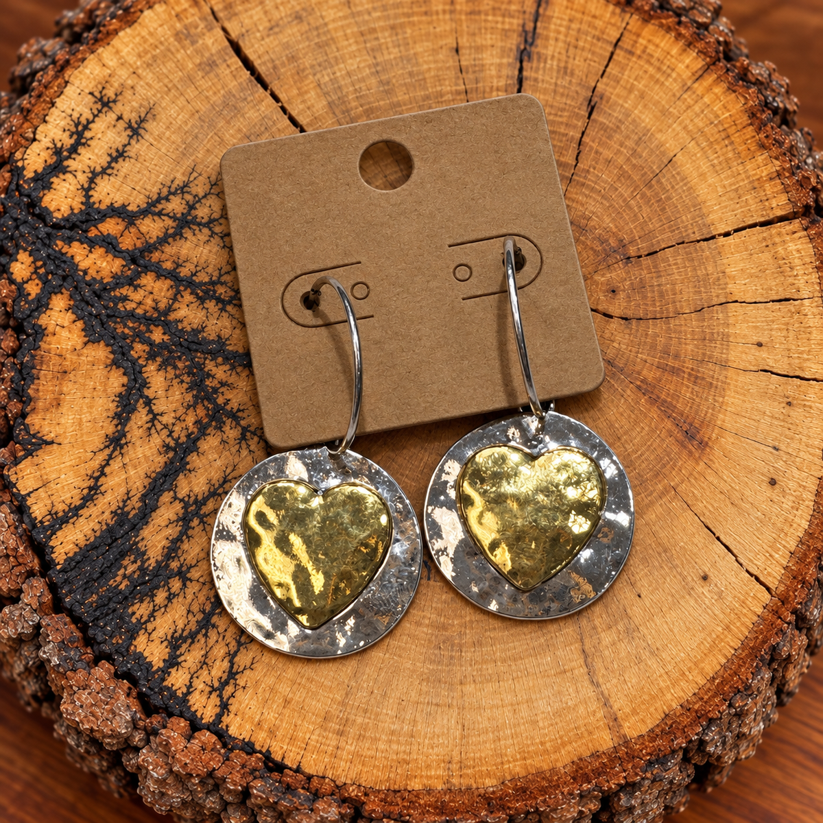 Two-Tone Gold Heart Hammered Disc Hoop Earrings on a plain kraft card