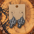 Silver-Tone Floral Scroll Cactus Drop Earrings on a plain kraft card