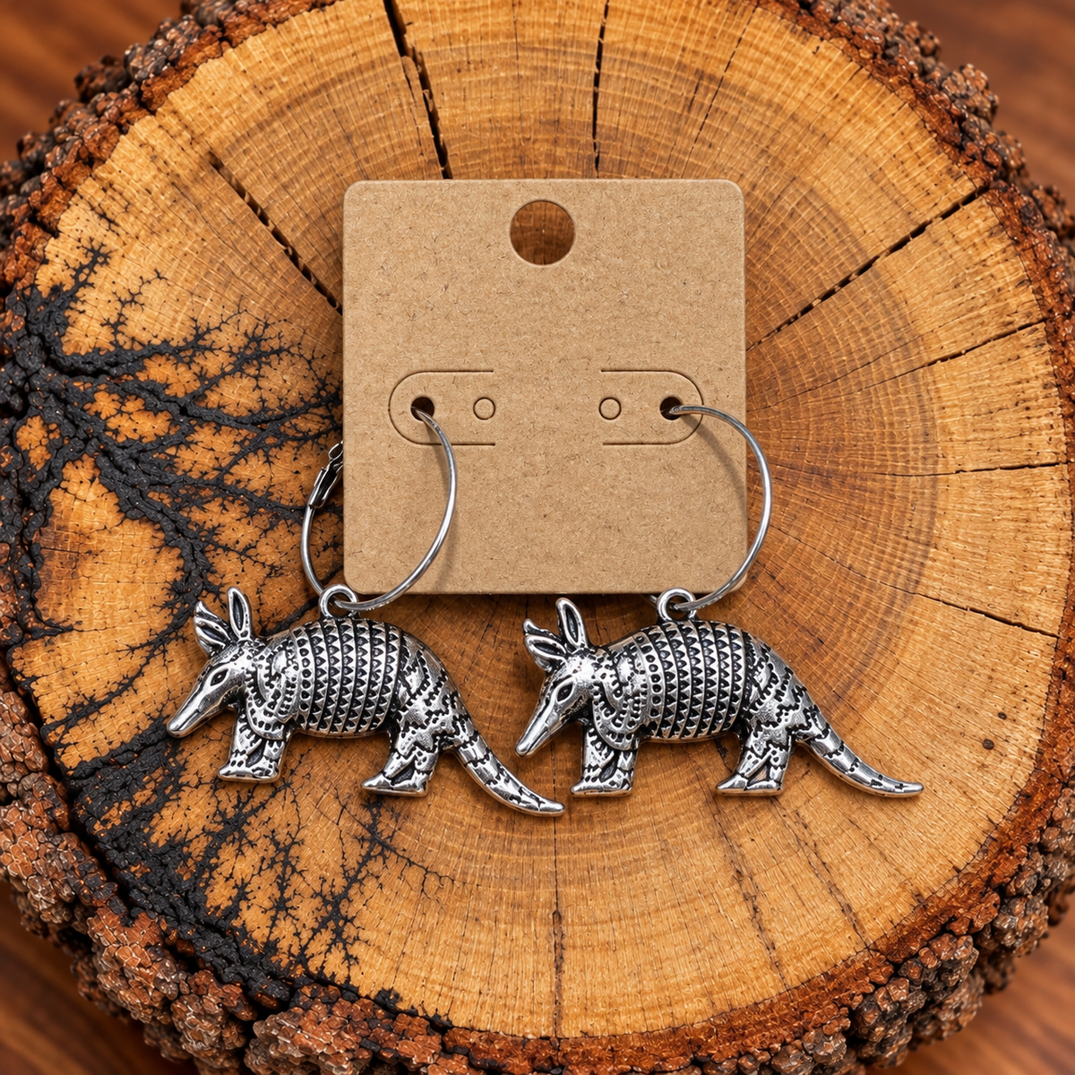 Silver-Tone Armadillo Hoop Earrings on a plain kraft card