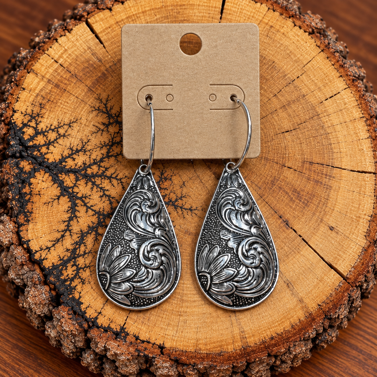 Silver-Tone Western Floral Teardrop Hoop Earrings on a plain kraft card