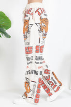 Side view of Tiger vintage feed sack wide-leg cotton pants
