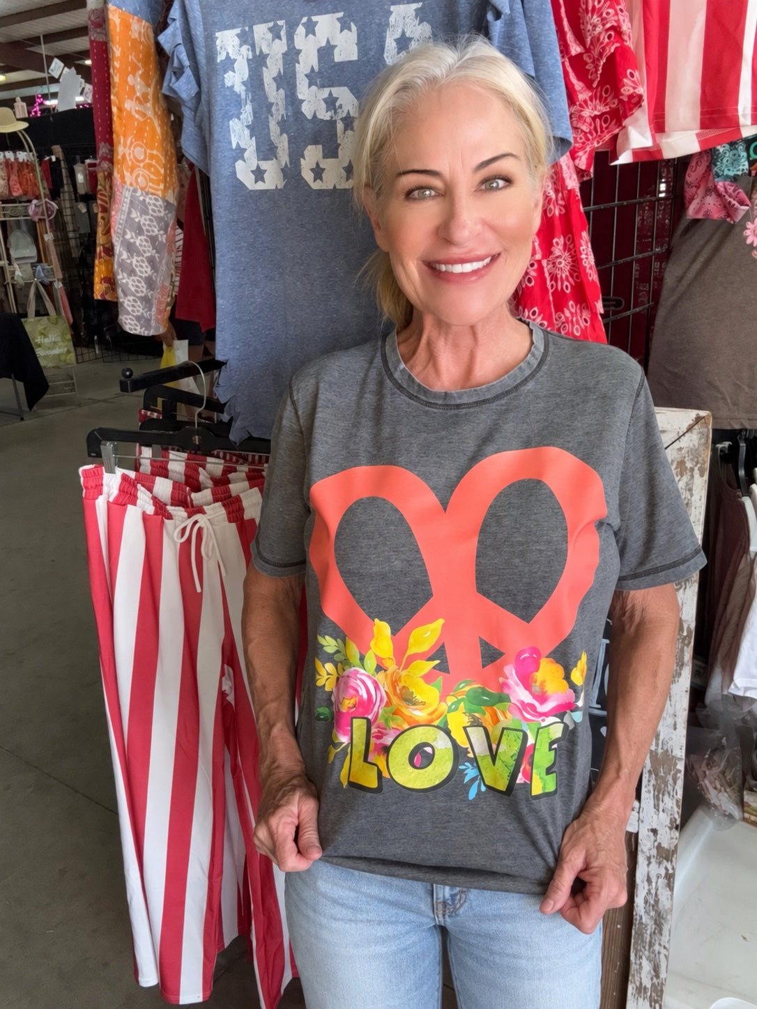 Floral Peace & Love Tee styled with light blue denim pants