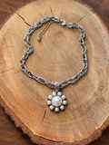 White Pearl Flower Necklace – Silver-Tone Chain on natural wood