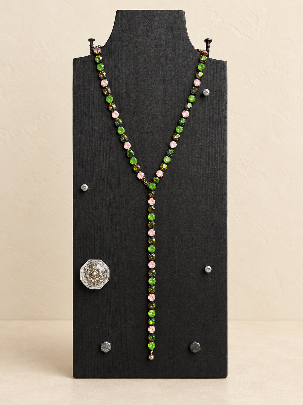 Green and pink magnetic Y necklace with long Y drop on a black display