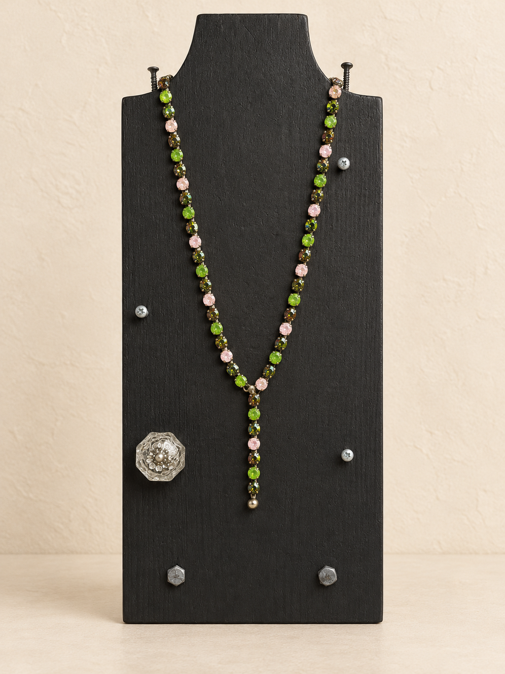 Green and pink magnetic Y necklace with short Y drop on a black display
