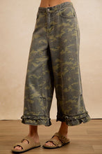 Angled front view of BIBI camouflage ruffle hem wide-leg pants