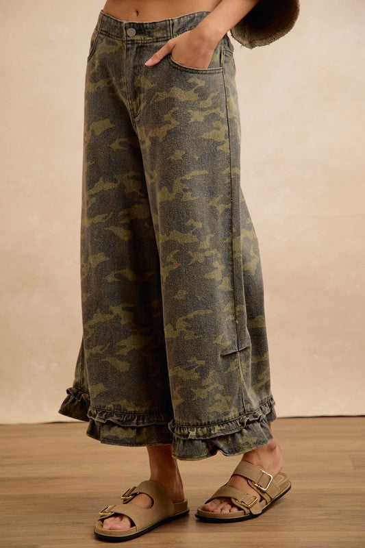 Side angle view of BIBI camouflage ruffle hem wide-leg pants