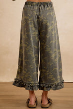 Back view showing elastic waistband of BIBI camouflage ruffle hem wide-leg pants