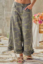 Front view of BIBI camouflage ruffle hem wide-leg pants