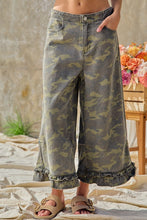 Front pocket view of BIBI camouflage ruffle hem wide-leg pants