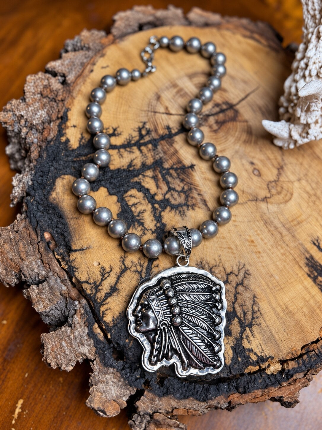 Silver-tone Western headdress pendant necklace with hand-knotted silver metal beads