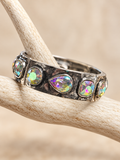Antiqued silver-tone bracelet with mixed-shape iridescent crystals on an antler display