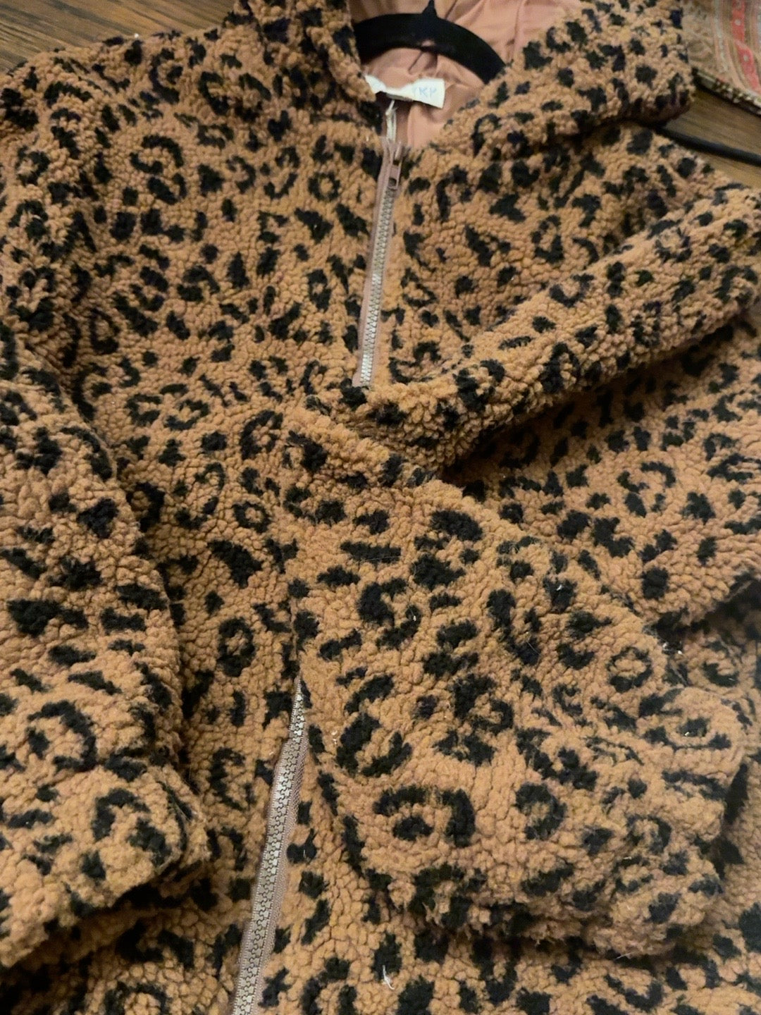 Tan and black leopard print sherpa zip-up jacket