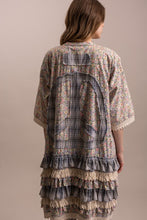 Back view of duster with large plaid peace sign