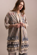Front view of Peace and Patchwork tiered ruffle duster