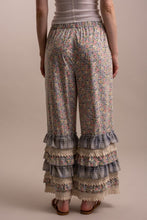 Back view of Peace and Patchwork tiered ruffle pants