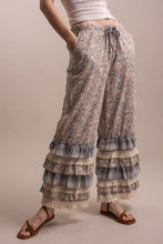 Angled front view of Peace and Patchwork floral ruffle pants