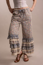 Front view of Peace and Patchwork tiered ruffle pants